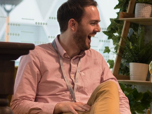 A man laughing at an event