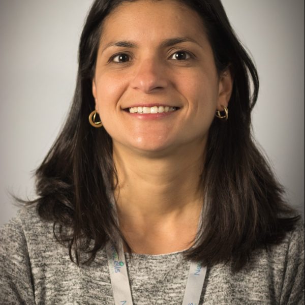 Professional photograph of Carolina Gandara smiling.